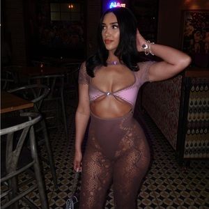 Poster girl jumpsuit color is a brown taupe, pink.